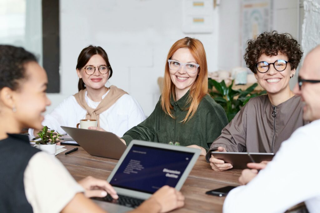 Hem people around a table with laptops